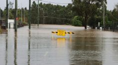 Flooded Street with a Sign