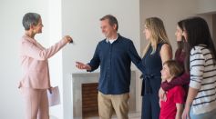 A Happy Family Talking to a Realtor