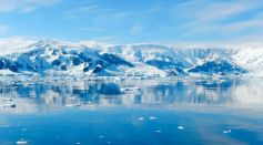 Large Body of Water and Snow Mountains
