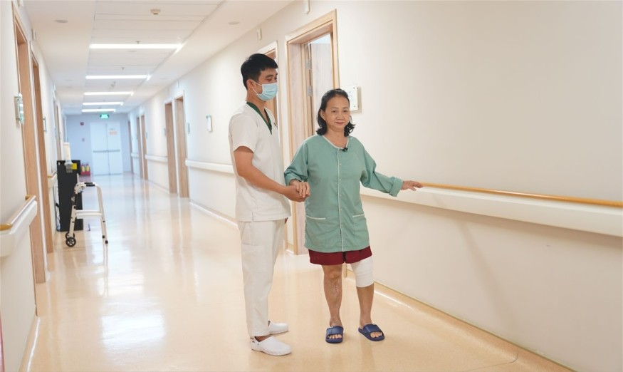 The patient was able to walk with staff assistance within 
