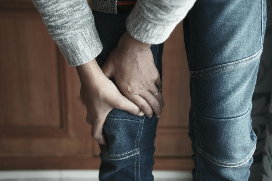 Person Holding the Knee