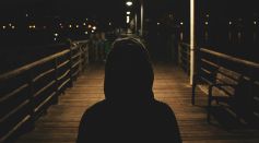 Person Wearing Hooded Jacket at Night