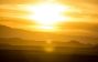 Sun Shining Over a Mountain Range