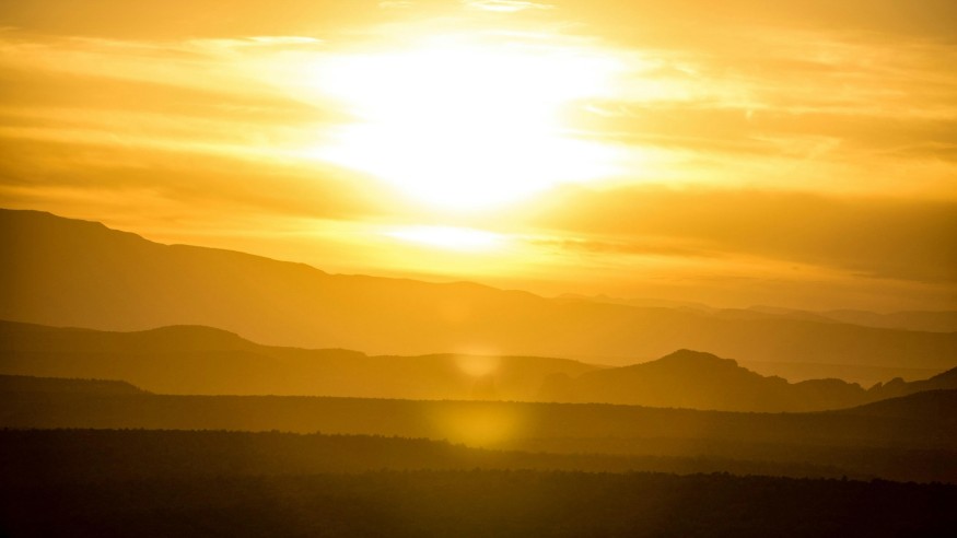 Sun Shining Over a Mountain Range