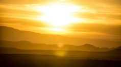 Sun Shining Over a Mountain Range
