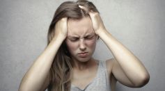 Woman Holding Her Head